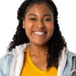 Professional headshot of smiling woman